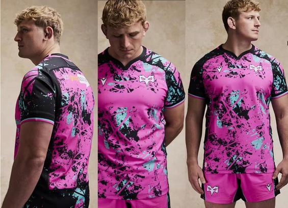 Model wearing the Ospreys’ 2025/26 European rugby kit — a striking pink and black Macron design made from recycled fabrics.