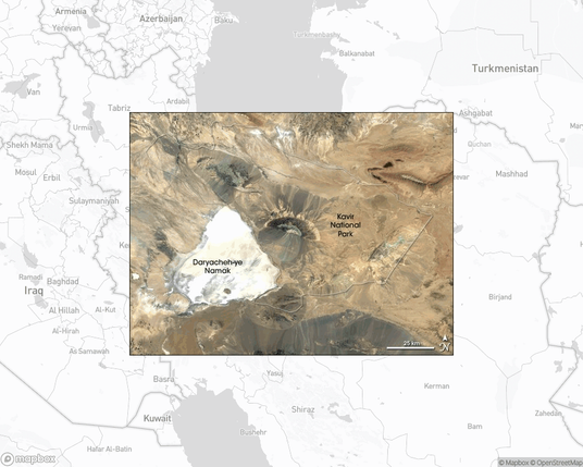 A photo of or from a national park from the linked website, overlaid on a cropped world map where it's located.