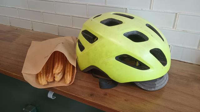 A bag of churros and my bike helmet
