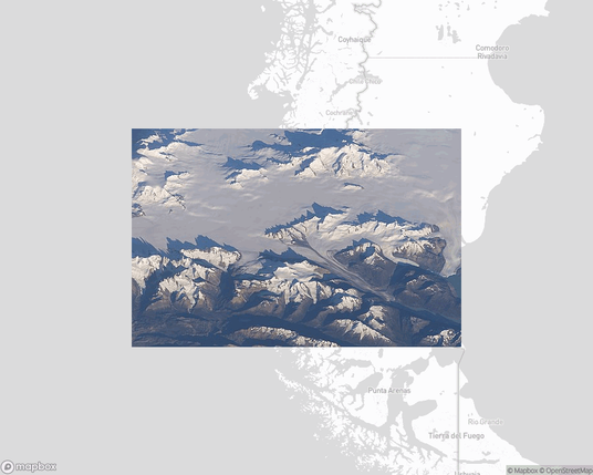 A photo of or from a national park from the linked website, overlaid on a cropped world map where it's located.