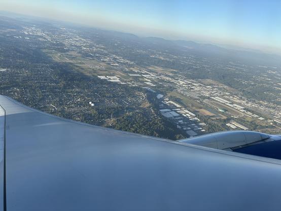 View from the window of a Delta Air Lines plane just after take-off. Somewhere around Seattle-Tacoma International Airport.