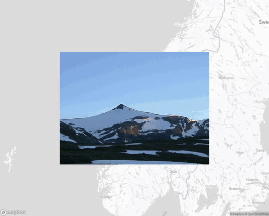 A photo of or from a national park from the linked website, overlaid on a cropped world map where it's located.
