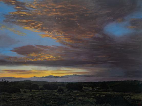 work in progress oil painting of the sun rising behind the Sangre de Christo Mountains in Santa Fe illuminating a sky full of clouds