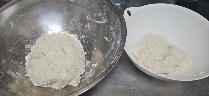 a photo of two dough balls in two bowls, one is about half the size of the other.