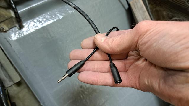 And audio plug on the cable that runs to the speaker box, and an audio jack that runs to the instrument panel.