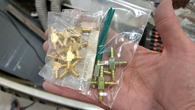 Two bags that hold brass 3-way and 4-way barb fitting blocks. They will be used to make multiple branching connections from the glider's pressure probes to various flight instruments.