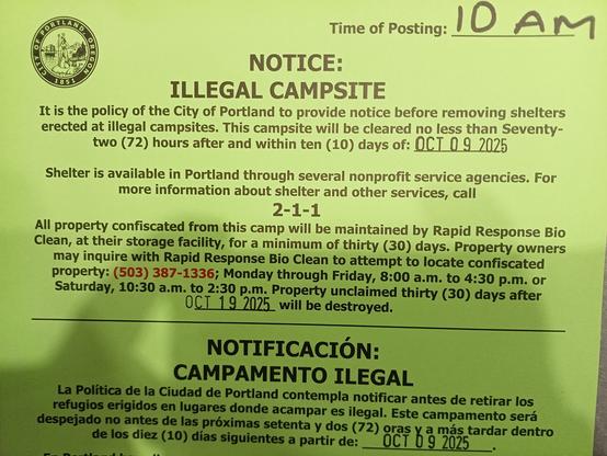 The image is a photograph of a bright green notice posted by the City of Portland regarding illegal campsites. At the top right corner, the time is stamped as “10 AM”. The notice begins with the heading “NOTICE: ILLEGAL CAMPSITE” and states: “It is the policy of the City of Portland to provide notice before removing shelters erected at illegal campsites. This campsite will be cleared no less than seventy-two (72) hours after and within ten (10) days of: OCT 09 2025”. Further down, it reads: “Shelter is available in Portland through several nonprofit service agencies. For more information about shelter and other services, call 2-1-1”. The notice also states: “All property confiscated from this camp will be maintained by Rapid Response Clean, at their storage facility, for a minimum of thirty (30) days. Property owners may inquire with Rapid Response Clean to attempt to locate confiscated property: (503) 387-1336; Monday through Friday, 8:00 a.m. to 4:30 p.m. or Saturday, 10:30 a.m. to 2:30 p.m. Property unclaimed thirty (30) days after OCT 19 2025 will be destroyed”. Below this is the same notice translated into Spanish, reading “NOTIFICACIÓN: CAMPAMENTO ILEGAL” with similar wording and dates.