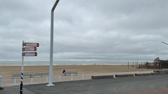 A grey sky over Scheveningen beach and the NorthSea in the distance.