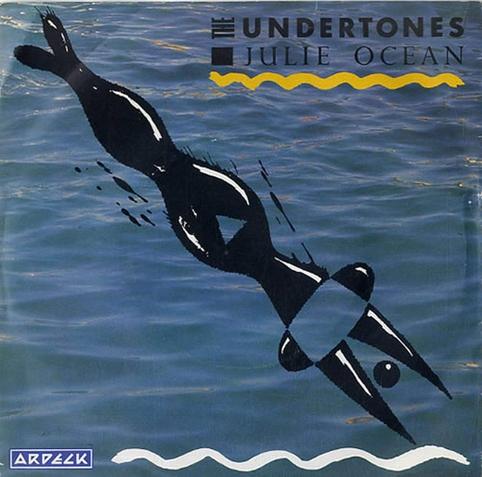 The sleeve art for The Undertones 1981 song "Julie Ocean". The picture is a close-up of the surface of a body of water. There is a stylized ink drawing of a diver in the foreground.