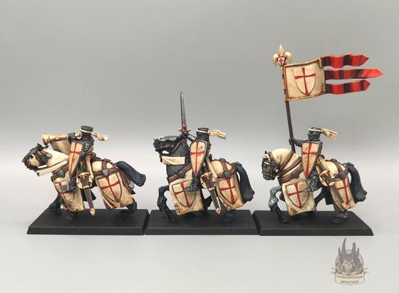 The command group of musician with bugle, champion with sword, and standard bearer in profile, left side