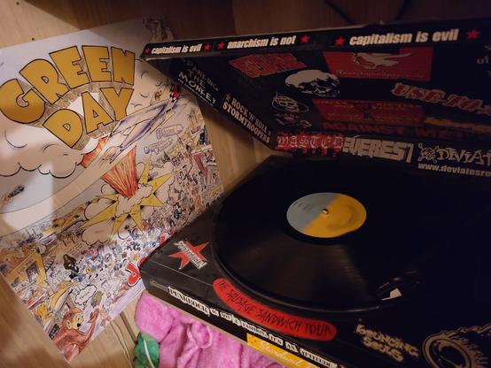 left side Green Day - Dookie Cover, right side is the record player with some stickers playing the record