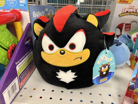 A Shadow the Hedgehog Squishmallows plush. He’s very round and a little cranky about it!