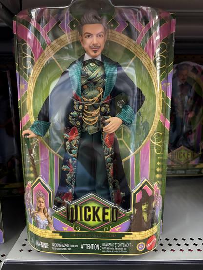 A Barbie-style doll of Jeff Goldblum’s character from Wicked. It’s a little cartoonishly stylized and yet still clearly Jeff Goldblum!