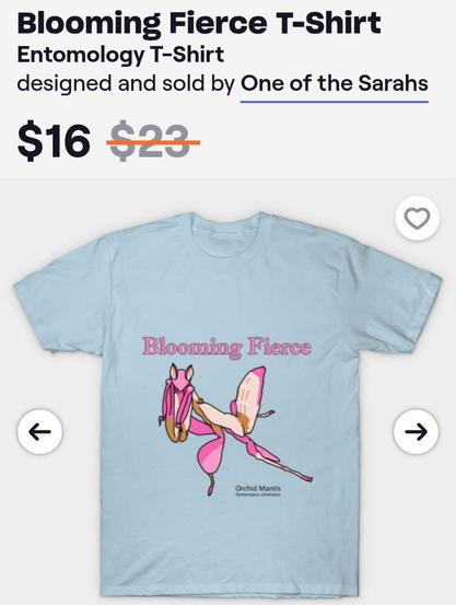 Screenshot of a TeePublic product page. A light blue shirt is printed with a graphic of a pink orchid mantis and the words "Blooming Fierce." The drawing is labeled with the scientific name below the design in small simple letters.