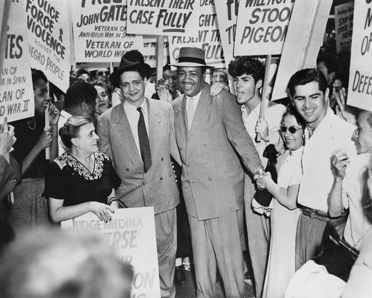 Defendants Robert Thompson and Benjamin J. Davis with supporters. By New York World-Telegram and the Sun staff photographer: Stieglitz, C. M., photographer. - Library of Congress Prints and Photographs Division. New York World-Telegram and the Sun Newspaper Photograph Collection. http://hdl.loc.gov/loc.pnp/cph.3c11434, Public Domain, https://commons.wikimedia.org/w/index.php?curid=1577587