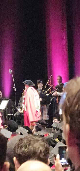 graduation ceremony led by a bagpipe.