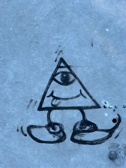 a marker drawing of a weird little guy in the form of an Illuminati-style eye-in-the-pyramid symbol only with legs and a goofy smile