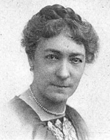 Annetta Ayers Saunders, from a 1922 publication. A White woman with dark hair in an updo, wearing a strand of pearls and a dark dress with a high square neckline