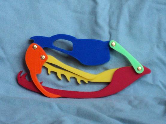 A 3d printed model for demonstrating the movement in a viper skull. Different part are printed in different colors. Mouth is closed.