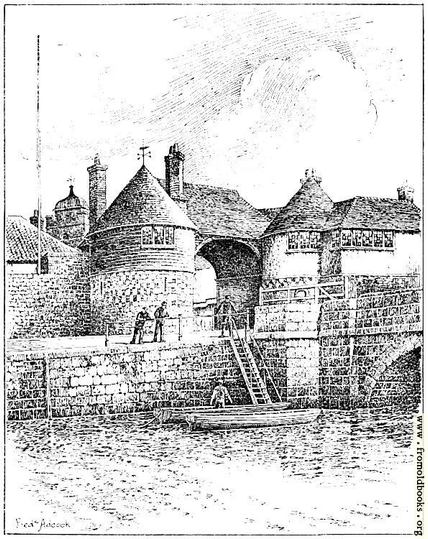 A wide arch with a roof and two circular turrets one on each side, at one end of a bridge. There are boats moored nearby, punts perhaps, and it looks like three people, maybe two men and a boy, are about to rent one. One of the turrets has a weather vane at the top.