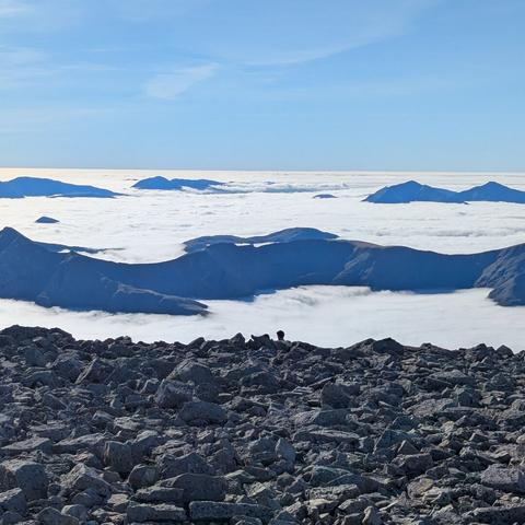 Mountains poking up through the clouds