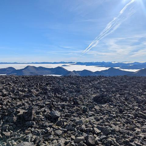 Mountains poking up through the clouds