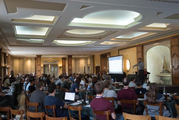 Group of people at SharkFest listening to a presentation.