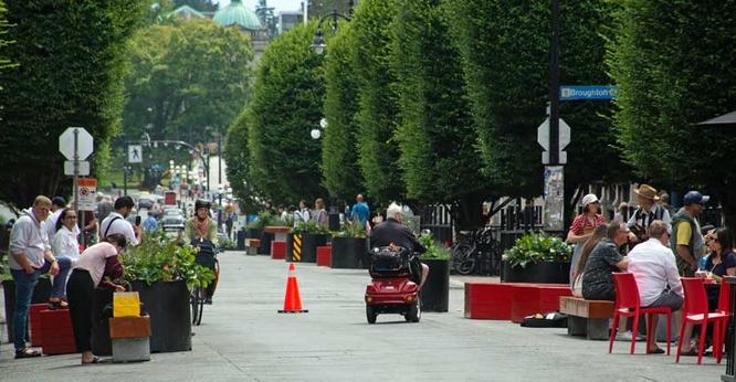 Person on mobility scooter on Government St pedestrian area.