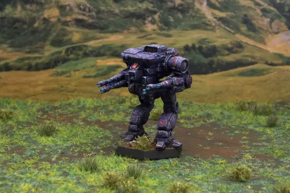 A painted miniature of a Warhawk 'Mech.  It is painted in a predominantly purple camo pattern with dots of lighter purple and rust red.  The cockpit glass is pink.  The miniature is photographed on grassy terrain.