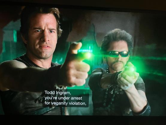 “Todd Ingram you are under arrest for veganity violation.”

Two vegan police with their hands formed as guns snd glowing lights coming out their fingers.