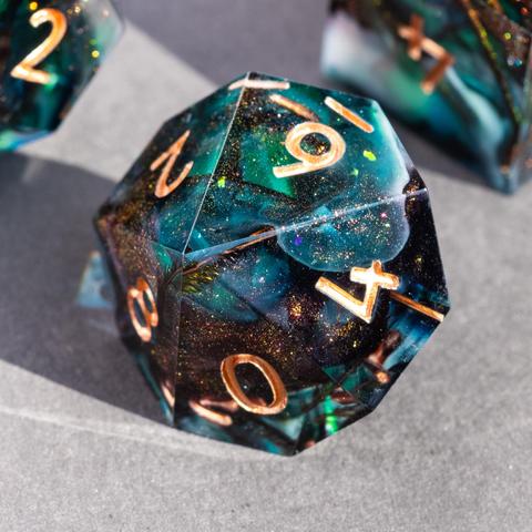 A D10 with peacock feathers and swirls of dark bronze glitter, green and white