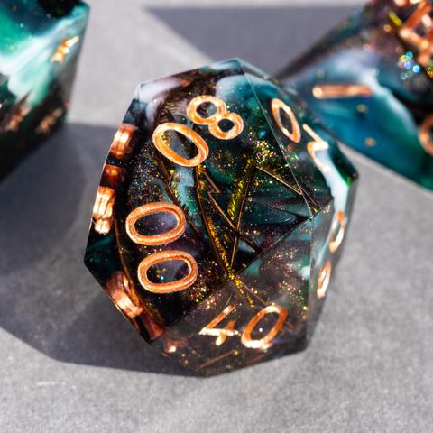 A D100 with peacock feathers and swirls of dark bronze glitter, green and white