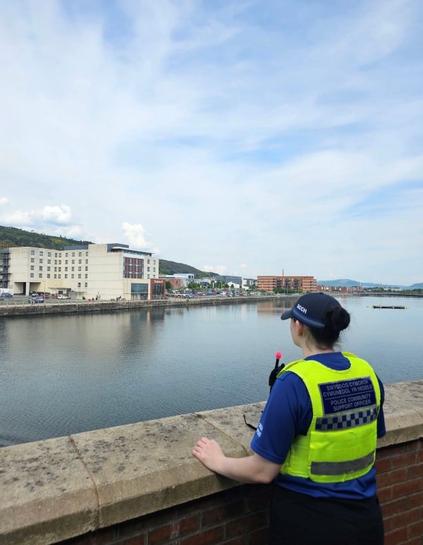 PCSO overlooking Swansea Docks waterfront buildings.