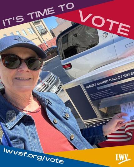 LWVSF member Michelle smiling, wearing a denim jacket, baseball cap, red shirt, and sunglasses, dropping off her vote-by-mail ballot in one of San Francisco's official ballot drop boxes.