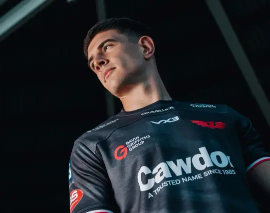 One Scarlets rugby player wearing the new grey away kit with Sosban Fach lyrics printed on the jersey.