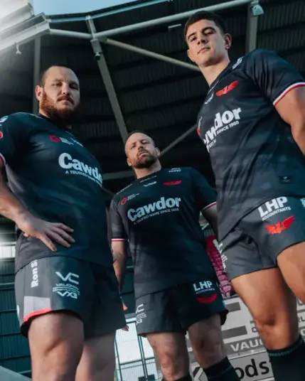 Three Scarlets rugby players wearing the new grey away kit for the 2025–26 season, standing together.