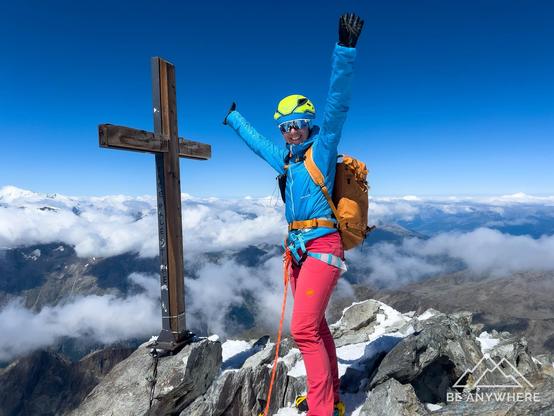 A woman at the top of Lagginhorn, happy that she made it.