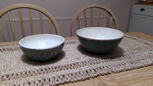 The same bowls, right side up, showing their white/cream inside glaze.
