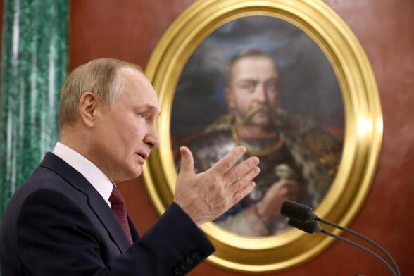Putin in front of portrait of notorious Jew killer Bohdan Khmelnytsky