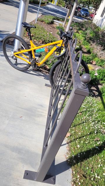 Yellow bike on a bike rack