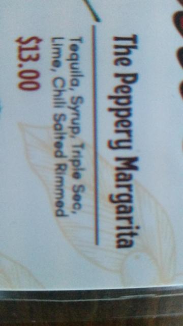 Photo of some text on a menu. It's rotated 90deg so you don't read it but look at the print. Where it's very noticeable that the cyan channel has a 1mm registration and this text is probably not using the black channel very much despite being almost entirely black.

If one was to read the text by rotating one's head it would say "Peppery Margarita" "Tequila, syrup, triple sec, lime, chilli salt rimmed."