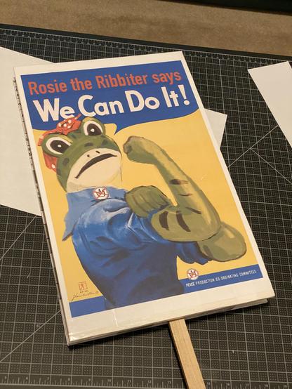 Rosie the Ribbiter (in the We Can Do It pose) on a No Kings protest sign.