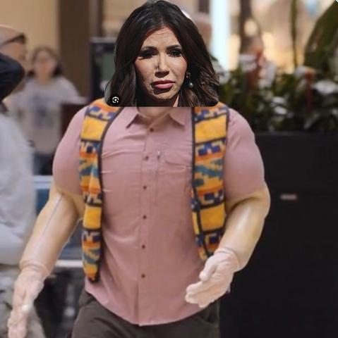 Image of Kristi Noem photoshopped into Karl Havoc’s chaotic costume from I Think You Should Leave, complete with rubbery mask, fake muscles, and dead eyes. She’s mid-breakdown, muttering about bad political choices and the weight of consequences—both literal and metaphorical.