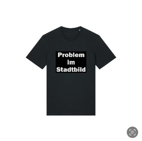 Für welche Werte steht unser Kanzler der Bundesrepublik Deutschland?
Bildbeschreibung (Deutsch):
Ein schwarzes T-Shirt trägt in weißen Blockbuch-staben die provokante Aufschrift „Problem im
Stadtbild"
. Das Bild steht symbolisch fur die Frage,
wer in Deutschland definiert, was als „Problem" gilt
- Menschen mit Empathie und demokratischem Wertebewusstsein oder jene, die aus rassistischen, faschistischen oder egoistischen Motiven Vielfalt bekampfen. Es spiegelt eine Gesellschaft, in der moralische Orientierung und politisches Rückgrat auf dem Prufstand stehen - auch fur den Kanzler der Bundesrepublik Deutschland.
Image Description (English):
A black T-shirt displays the bold white lettering
"Problem im Stadtbild" ("Problem in the City-scape"). The image symbolizes the deeper question of who defines what is seen as a "problem" in Germany - those guided by empathy and democratic values, or those who attack diversity from racist, fascist, or self-serving motives. It reflects a society in which moral integrity and political courage are being tested - including that of the Chancellor of the Federal Republic of Germany.🖖