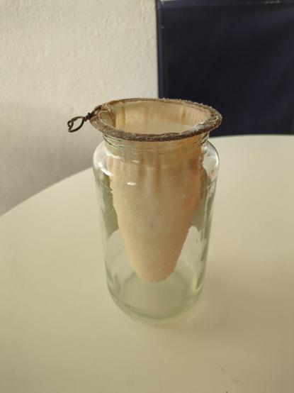 Milk kefir passing though a cloth.