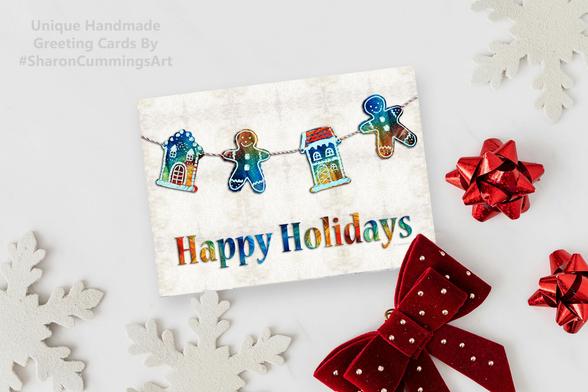 Colorful gingerbread mean and houses with Happy Holidays by artist Sharon Cummings.