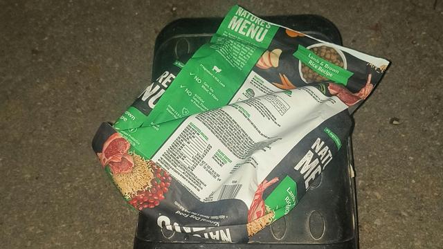 Photo of flat empty dog food bag.