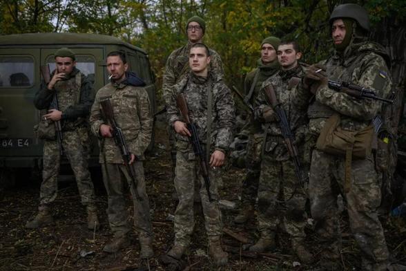 Infantry recruits of the 28th Separate Mechanized Brigade listen to an instructor while undergoing a basic training course at an undisclosed location in eastern Ukraine, Fall 2025
