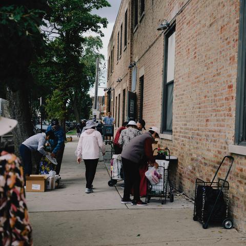 Outside the Pilsen Food Pantry in Chicago. The divide between rich and poor is hardly new, in Chicago or the rest of the country, but it has become more pronounced in recent months.