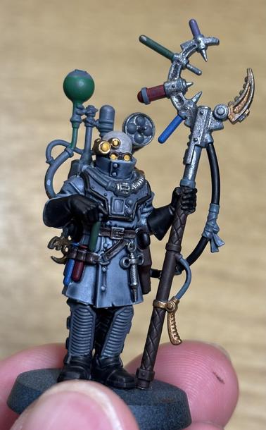 Genestealer Cults Biophagus miniature, base coated in most areas and with a wash applied to his lab coat.